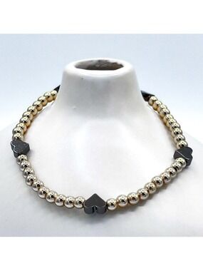 Gold beads with black hearts bracelet.